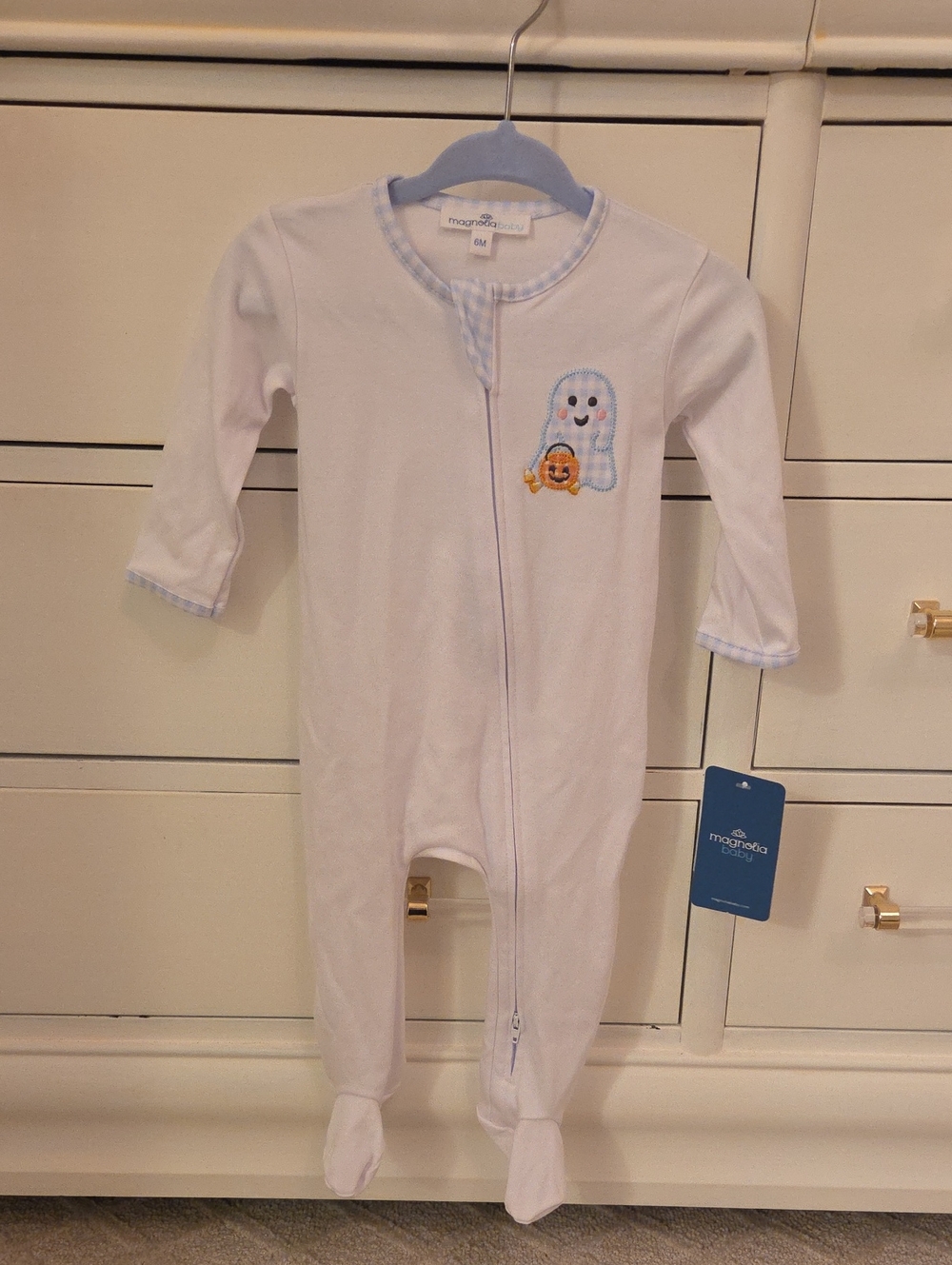 Magnolia White Footed One-Piece with Light Blue Trim and Ghost Appliqué